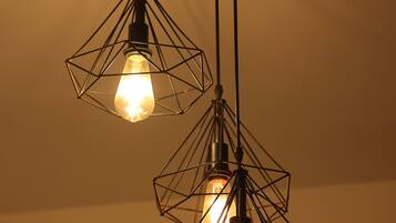 A ceiling with geometric light fixtures.