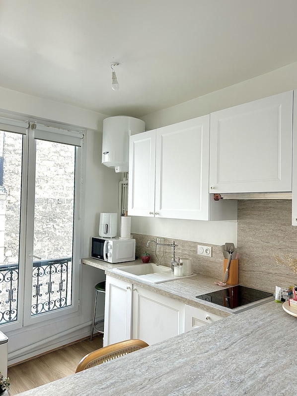 Fridge, microwave, cookware/dishes/utensils
