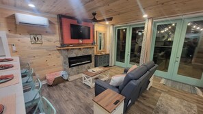 Smart TV, fireplace, DVD player, books