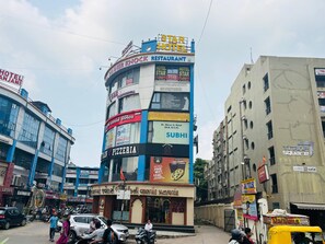A multi-story building with a 'Star Hotel' sign, 'Diner Knock Restaurant' on the ground floor, and 'Captain A Pizzeria' below.