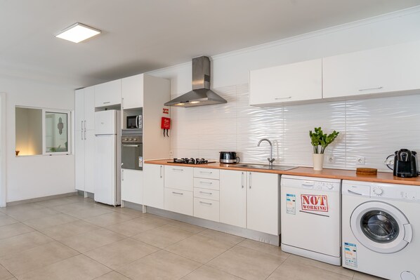 Fridge, microwave, oven, cookware/dishes/utensils