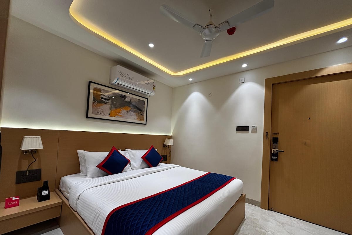 Deluxe Room | Ropa de cama de alta calidad y caja de seguridad en la habitación