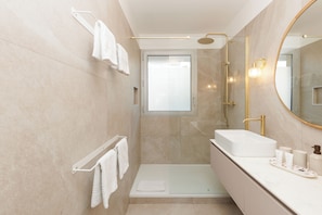 Shower, hair dryer, towels, soap