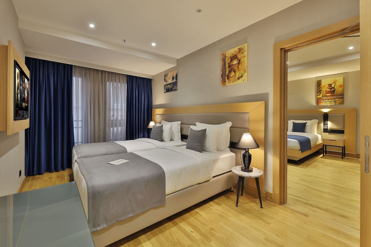 Family Quadruple Room, 2 Bedrooms, 2 Bathrooms | In-room safe, soundproofing, free WiFi, bed sheets