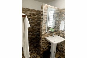 Shower, towels, soap, toilet paper