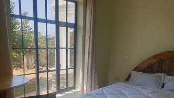 2 dormitorios, tabla de planchar con plancha, wifi gratis y ropa de cama