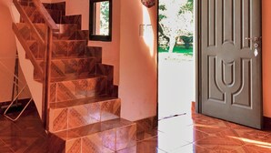 A staircase with patterned tiles leading to a door marked with the number 10. - El manantial de Iguazu (Puerto Iguazú)