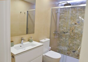 Shower, hair dryer, towels, soap
