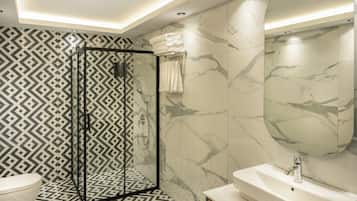 Shower, hair dryer, slippers, towels