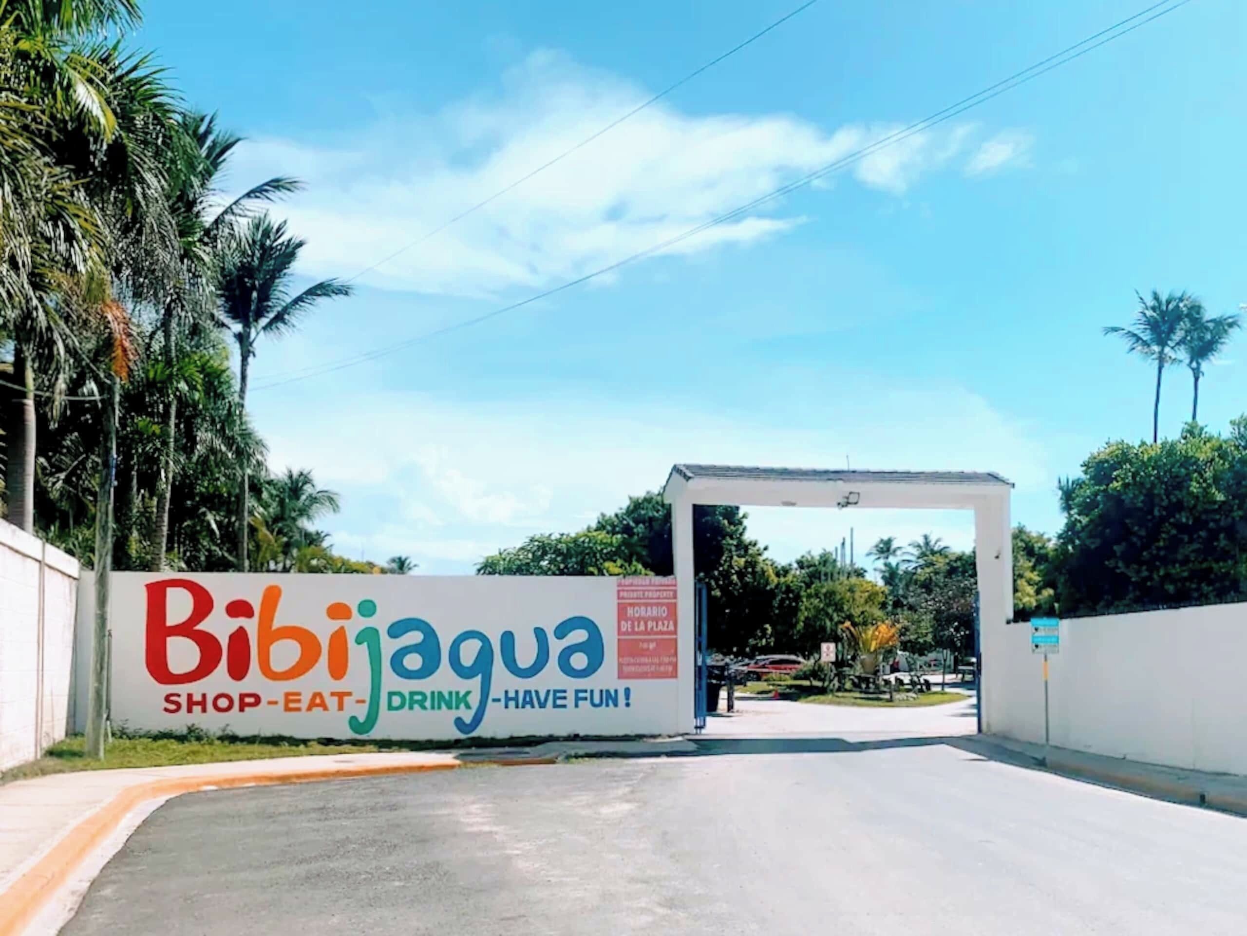 A sign for Bibijagua with the words 'SHOP-EAT-DRINK-HAVE FUN!'
