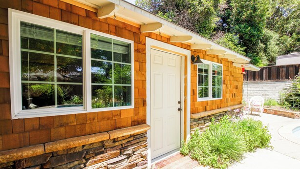 A house with a stone foundation, wooden siding, and a white door. - Walk to Village & 5C's & Trader Joe's/Private Pool (Claremont)
