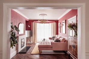 TV, fireplace, books