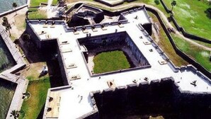 An aerial view of a fort with a complex layout, including multiple bastions and a central courtyard.