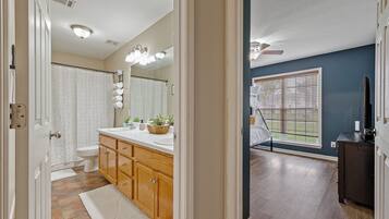 Shower, jetted tub, towels, soap
