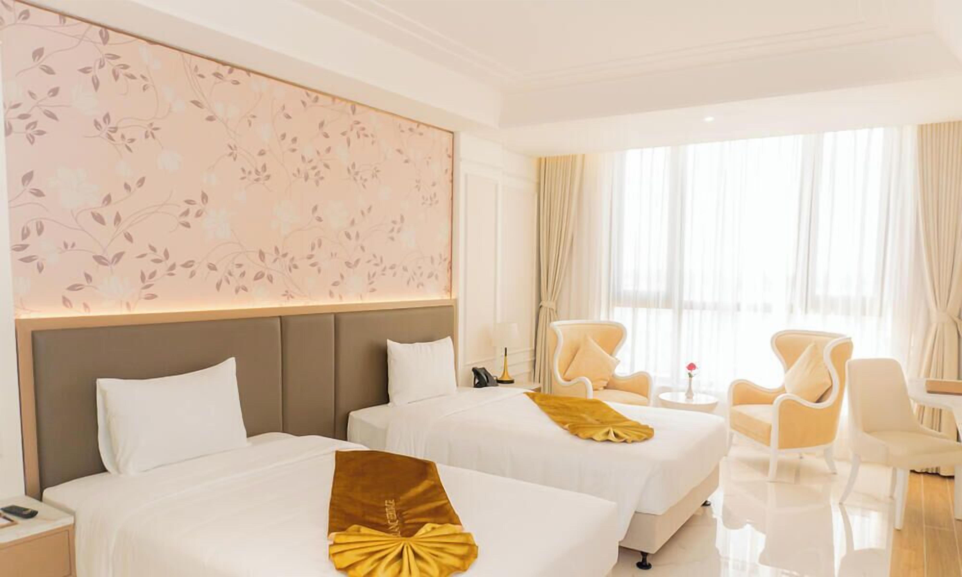 Habitación ejecutiva con 2 camas individuales | Ropa de cama de alta calidad, camas con pillow-top y minibar 