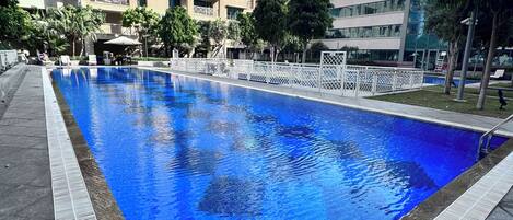 Outdoor pool, open 7:00 AM to 10:00 PM, pool umbrellas, pool loungers