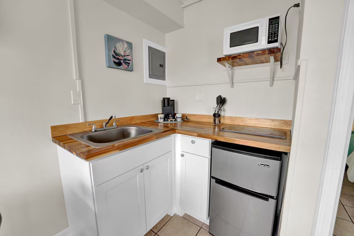 Fridge, microwave, coffee/tea maker, dining tables