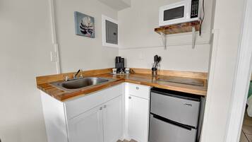 Fridge, microwave, coffee/tea maker, dining tables