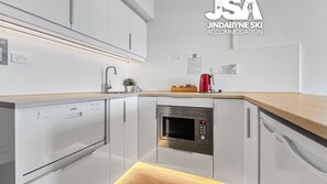 Microwave, toaster, dining tables