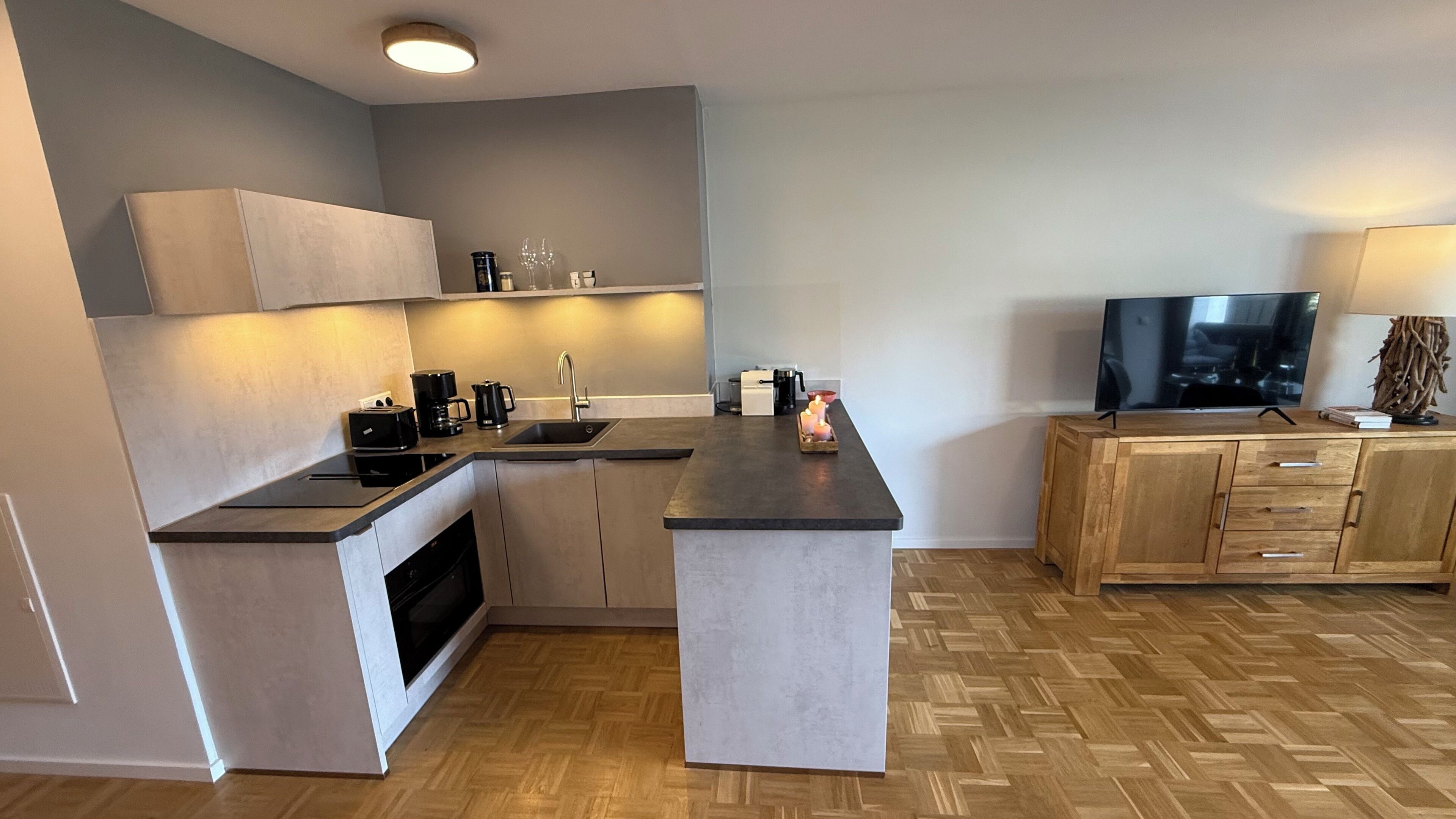 Fridge, stovetop, dishwasher, coffee/tea maker