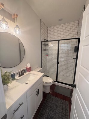 Shower, towels, soap, toilet paper