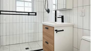 Shower, hair dryer, towels, toilet paper