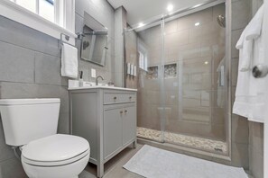 Shower, hair dryer, towels, soap