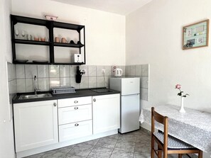Fridge, microwave, coffee/tea maker, dining tables
