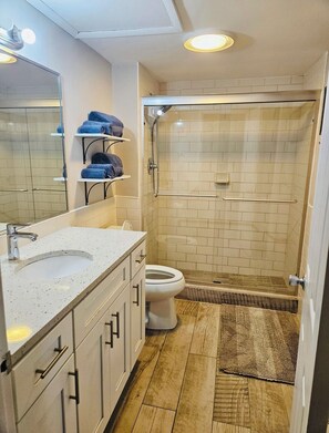 Shower, hair dryer, towels, soap