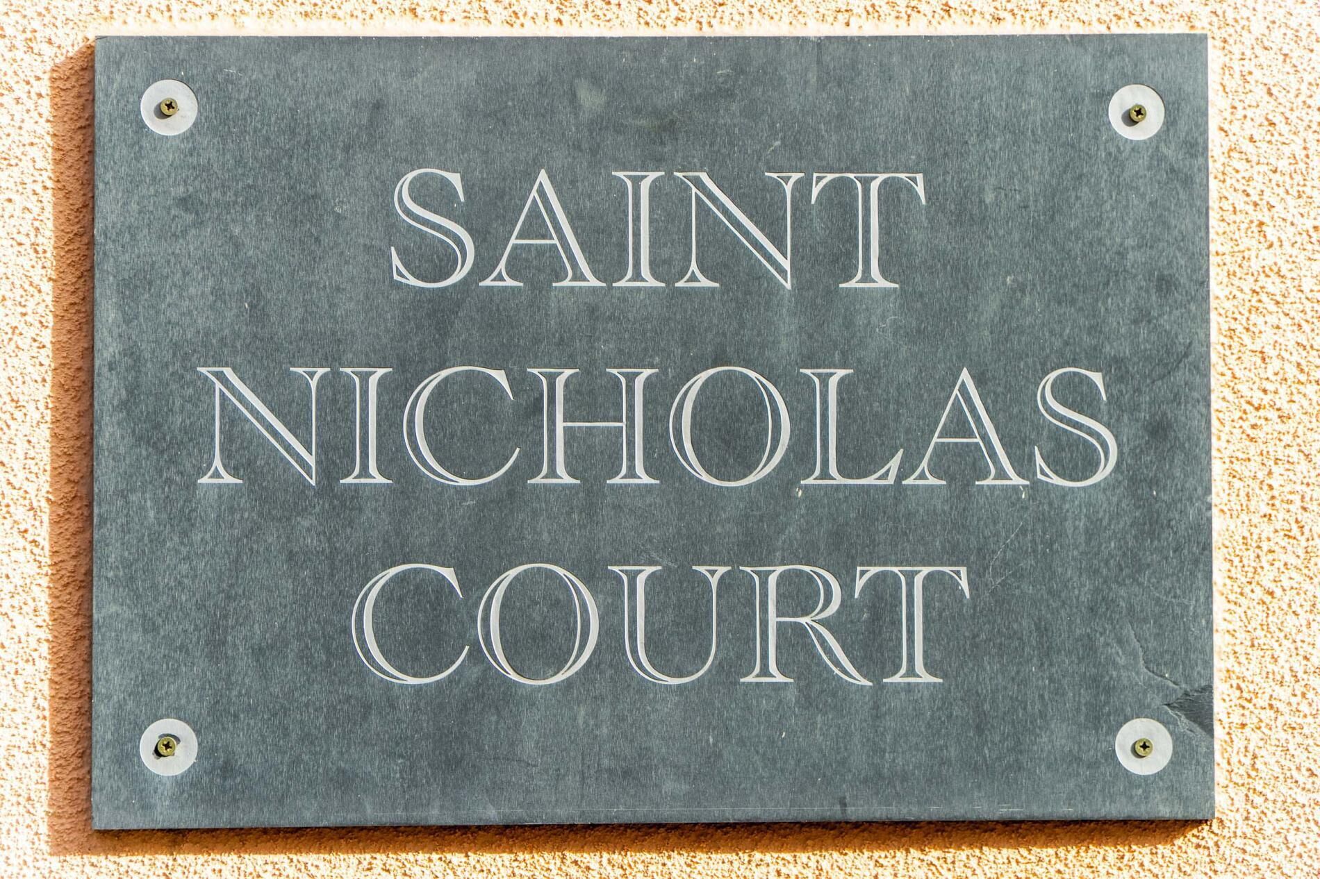 A sign with the text "SAINT NICHOLAS COURT".