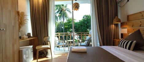 Deluxe Double or Twin Room, Balcony, Partial Sea View | Minibar, in-room safe, desk, laptop workspace