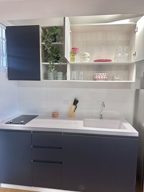 Fridge, microwave, stovetop, coffee/tea maker