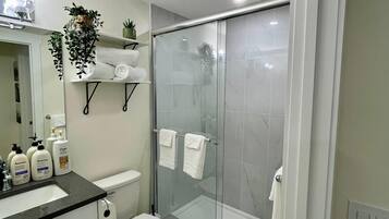 Shower, hair dryer, towels, soap