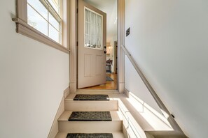A staircase with a door at the top leading to a room. - Charming Apt w/ Shared Outdoor Space in Lisbon! (Lisbon)