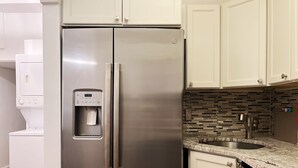 A stainless steel refrigerator with a water dispenser, a built-in ice maker, and a freezer compartment. - Ramblei near Rittenhouse Sq / 2 bedroom – Unit B (Philadelphia)