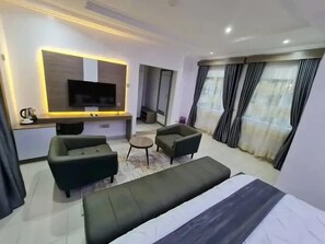 Junior Apartment, Balcony, City View | In-room safe, desk, laptop workspace, blackout drapes
