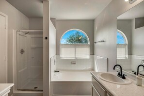 Shower, hair dryer, towels, toilet paper