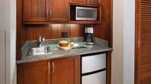 Fridge, microwave, coffee/tea maker, cookware/dishes/utensils