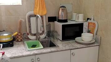 Luxury Apartment, Balcony, City View | Private kitchen | Fridge, microwave, oven, stovetop