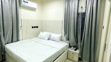 Luxury Apartment, Balcony, City View | Desk, laptop workspace, blackout drapes, soundproofing