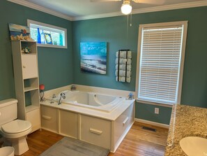 Jetted tub, hair dryer, towels, toilet paper