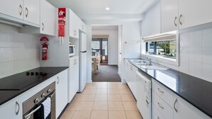 Fridge, microwave, oven, stovetop - "Orion" 3BR Water Views Apartment Main Street of Huskisson by Nautilus Apartments Jervis Bay (Huskisson)