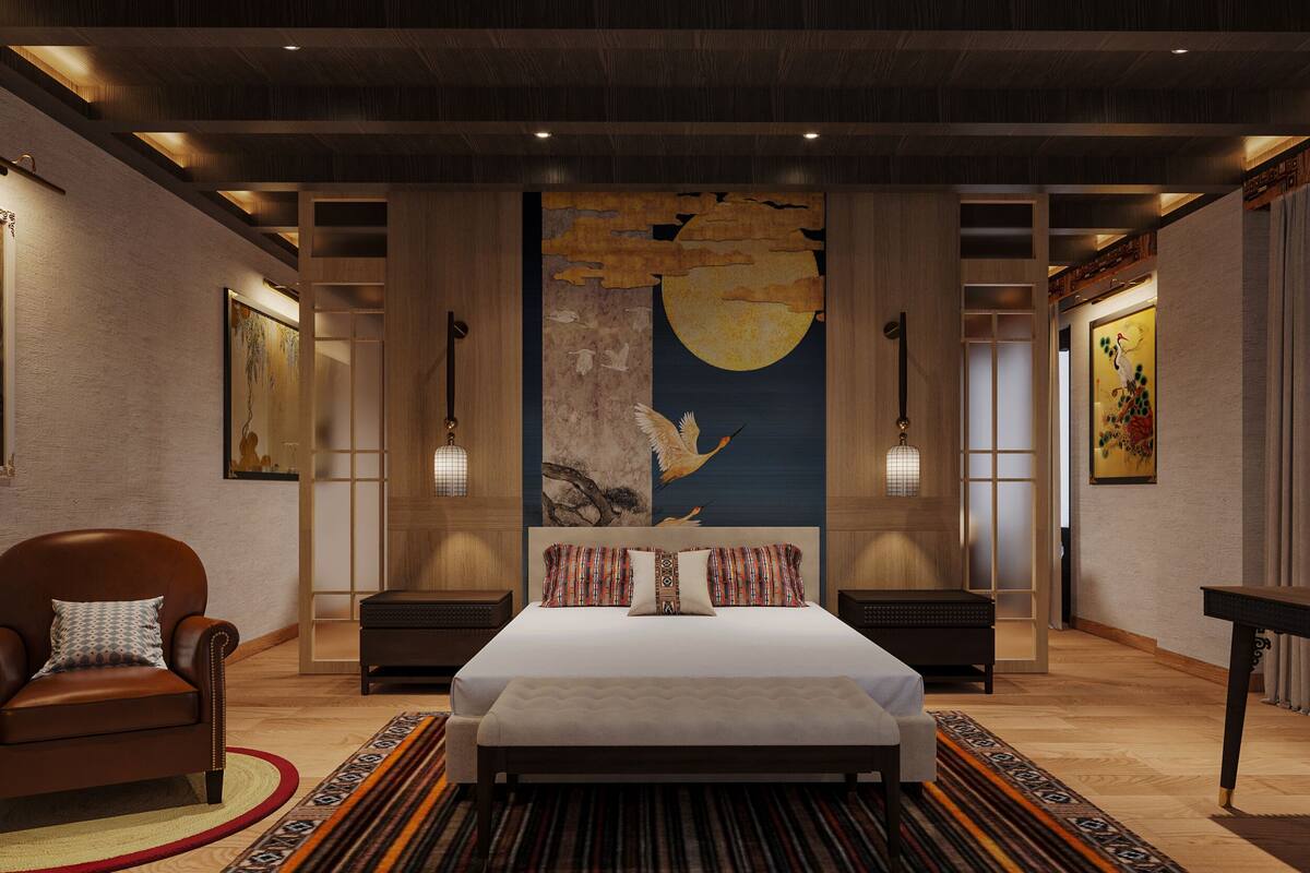 Un dormitorio amplio con una cama grande, suelo de madera y un mural con un cielo nocturno en la pared.