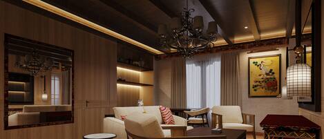 A modern living room with a sofa, armchairs, a coffee table, a TV, and a decorative cabinet.