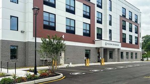 A modern building with a sign reading "VISION RIVERSIDE". - 403 Modern Brand New Studio Apartment (Old Bridge)