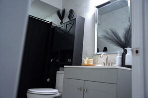 Shower, towels, soap, toilet paper