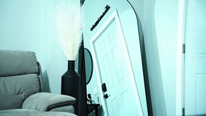 A room with a bed, a mirror, and a door. - Modern Minimalist Home in the heart of Reading (Reading)