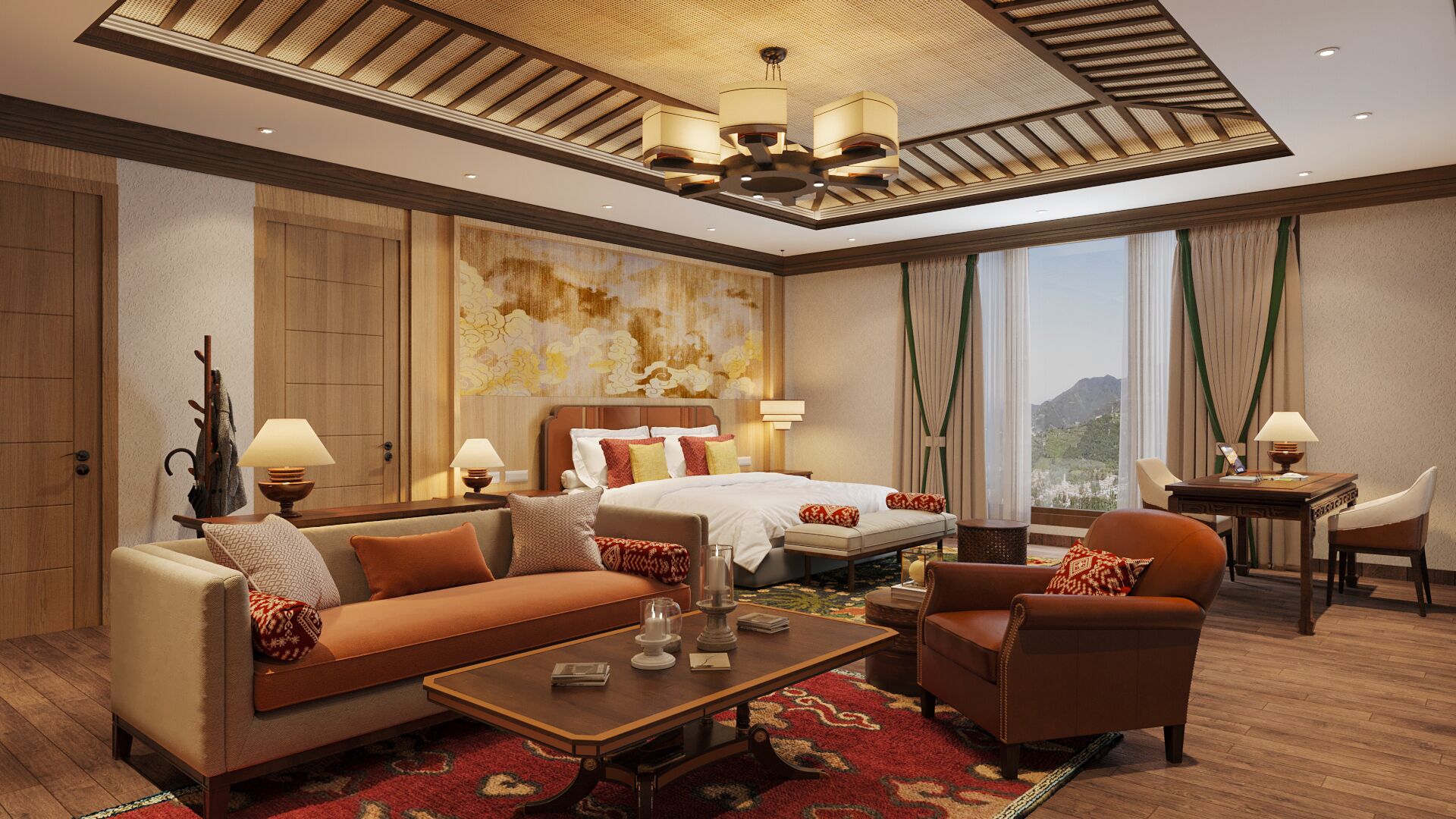 A spacious hotel room with a large bed, a sofa, a chair, a desk, and a view of a mountainous landscape through the window.