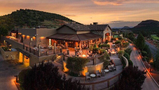 A resort with outdoor seating areas, a fire pit, and a view of the surrounding landscape. - Luxury Townhome - Exclusive guest access to a members-only golf club and resort amenities including pool. (Sedona)