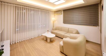 This is a three-bedroom place in Gangnam, perfect for families